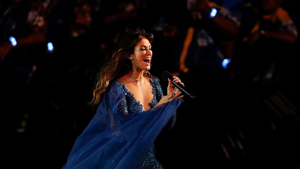Warbling away: Australian singer Delta Goodrem performs during the ceremony PICTURE: AFP