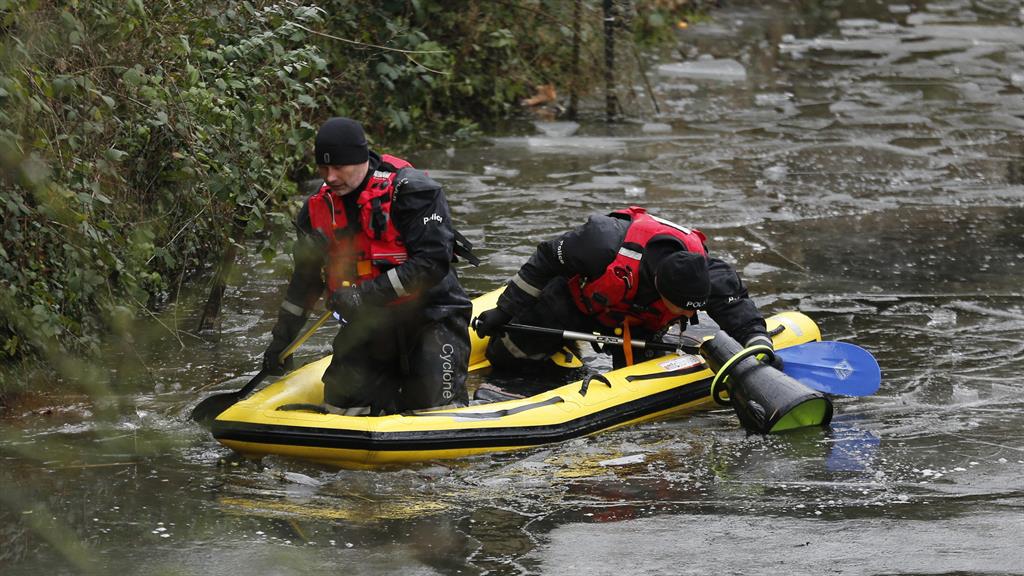 Search goes on: Police divers at the Beverley and Barmston Drain in Hull, near where Libby was last seen PICTURES: SWNS/PA