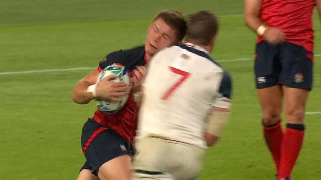 Moment of impact: John Quill's dangerous high tackle on England's Owen Farrell earned him the first red card of the Rugby World Cup PICTURE: ITV