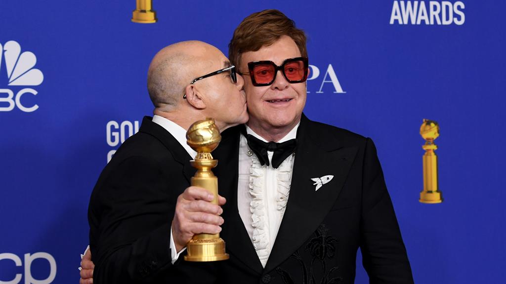 I'm still standing: Sir Elton gets his own Golden Globe with Bernie Taupin (left) for best original song, from Rocketman PICTURE: GETTY