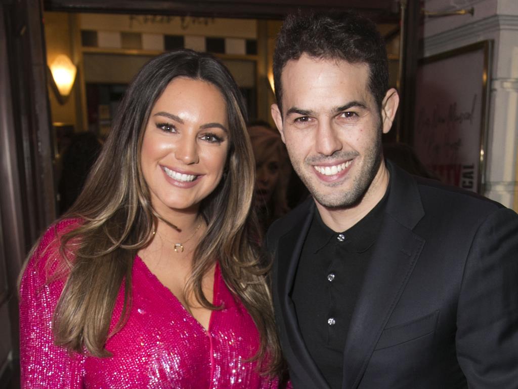 He bowls me over: Kelly with boyfriend Jeremy Parisi PICTURE: REX