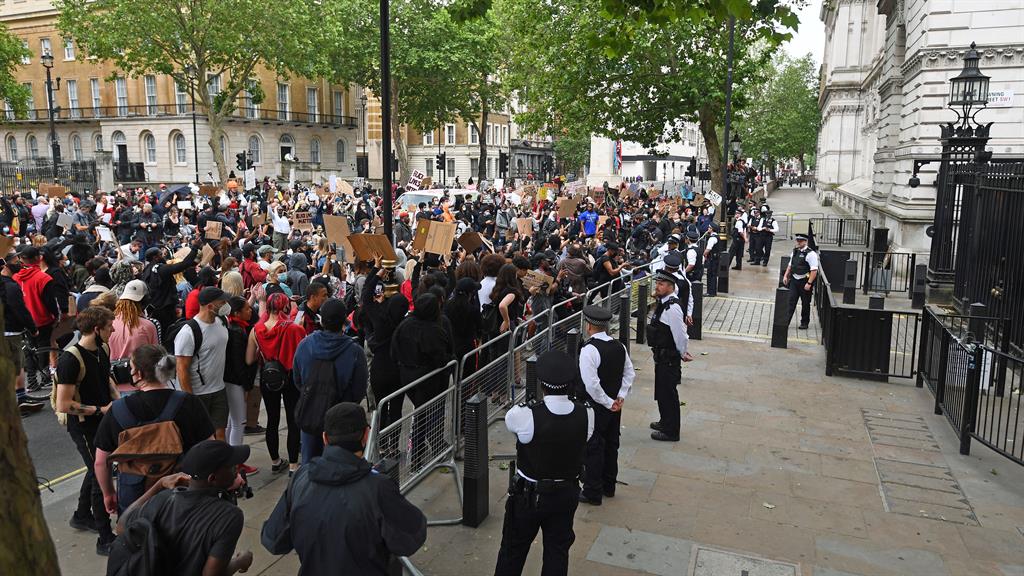 Move along: Protesters also stopped at the gates of Downing Street, where Boris Johnson has faced calls to review sales of riot control equipment to the US PICTURE: PA