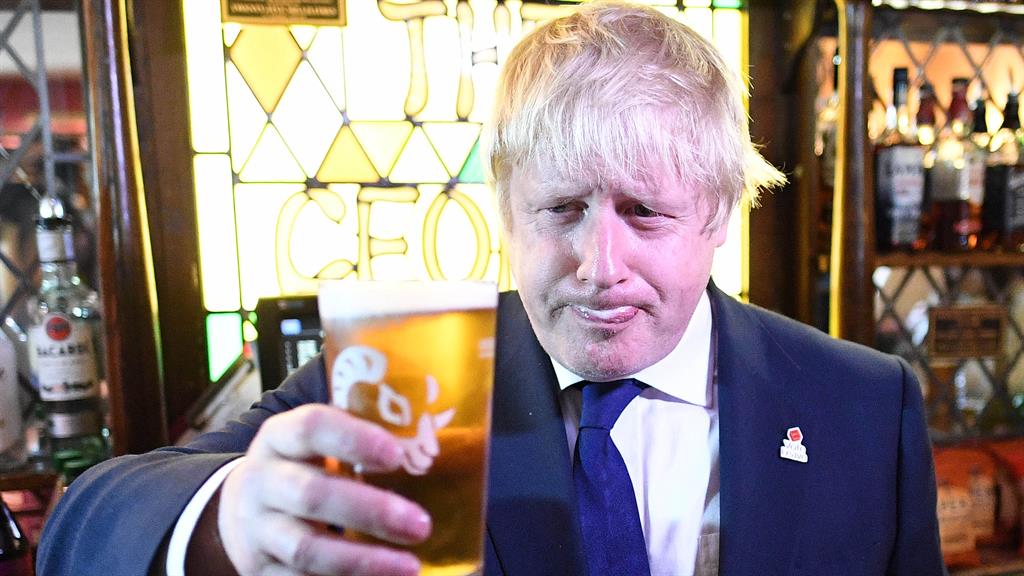 Mine's a pint: Boris was having a heart-to-heart with the Covid-19 strategy committee this afternoon PICTURE: REX