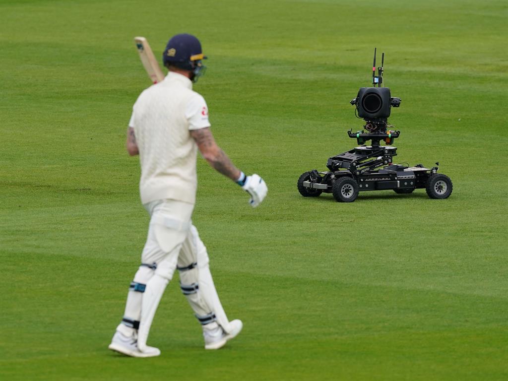 Social distancing: A remote-controlled camera follows England's Ben Stokes on his way out before play this morning PICTURE: GETTY
