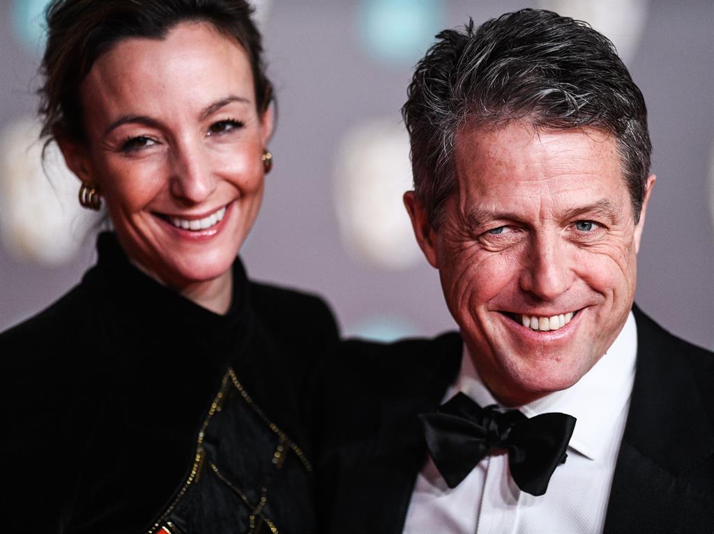 Family man: Hugh with his wife Anna Elisabet Eberstein; and, below, with screen wife Nicole Kidman in The Undoing