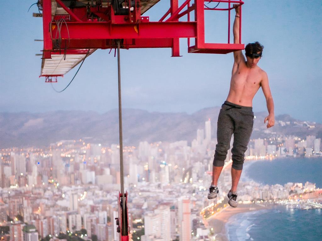 Togs on: Adam before removing his trousers; and, below, easing down to catch the view