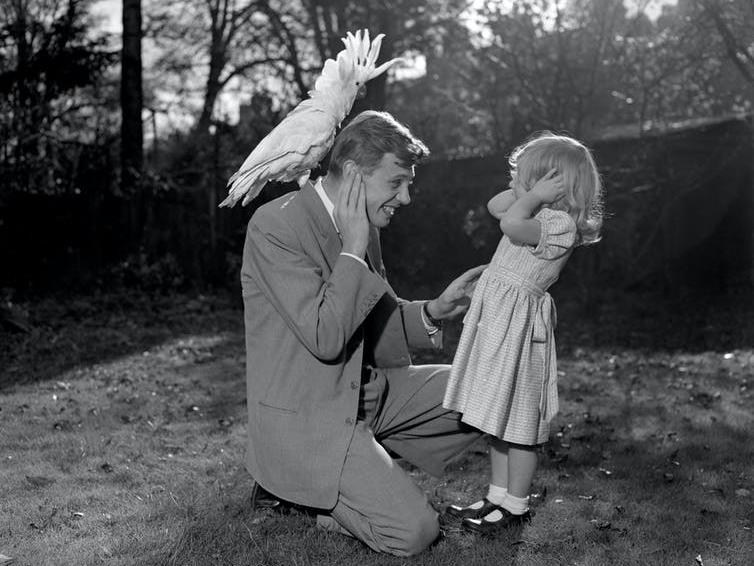 Enthusiast: Attenborough, his daughter, and a sulphur-crested cockatoo, 1957 PICTURE: PA